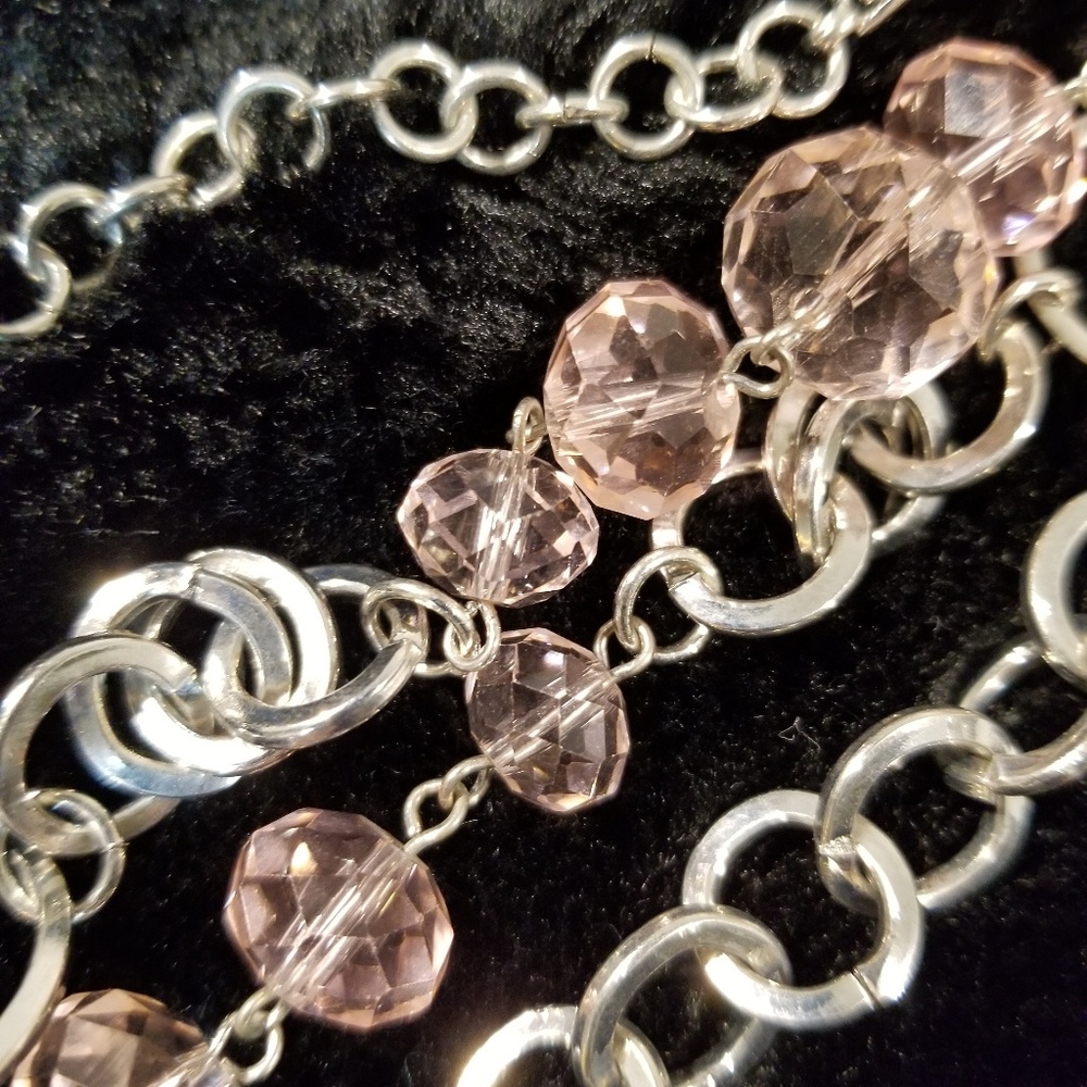 Silver colored chain with light pink beads